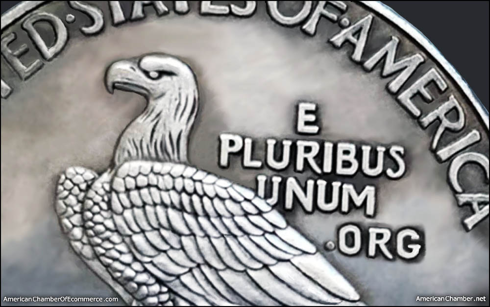 closeup detail of an old silver dollar with the head of an eagle and the phrase E Pluribus Unum